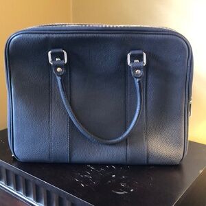 Italian leather, Navy blue briefcase.  Never been used. 3 zipper compartments.